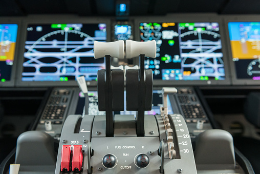 Flight deck of a Boeing 787 aircraft with flat-panel LCD displays showing all the data required by a pilot to fly the aircraft\n\nAircraft is stationery on ground at Abu Dhabi International Airport