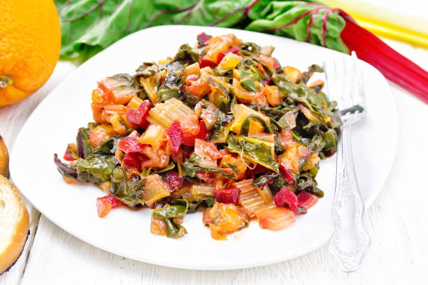 istock Mangold braised in plate on wooden board 1131734631