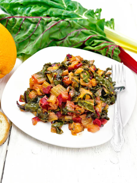 istock Mangold braised in plate on light wooden board 1131734633