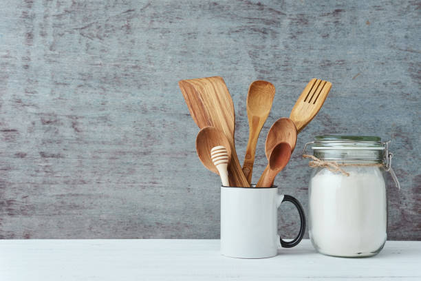 Kitchen utensils in ceramic cup on a gray background, copy space Kitchen utensils in ceramic cup on gray background, copy space cooking utensil stock pictures, royalty-free photos & images