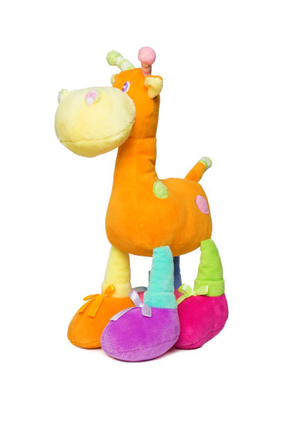 istock Plush, fluffy colorful giraffe toy isolated on white 1131738022