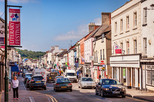 3 June 2016: Monmouthshire, Wales, UK - Monnow Street, the main shopping street in the town, with a banner advertising the Literary Festival.