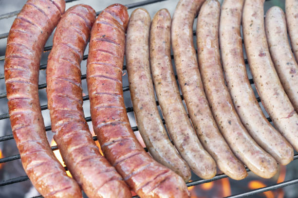 istock Grilling sausages on barbecue grill 1131740398