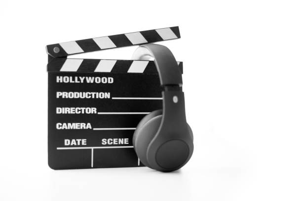 istock Hollywood slate board and headphone on white 1131741471