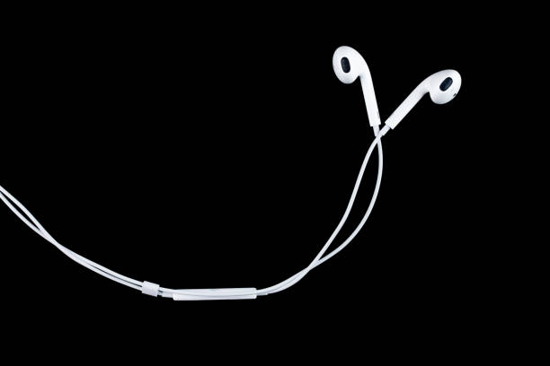 istock earphones on black background. 1131744996