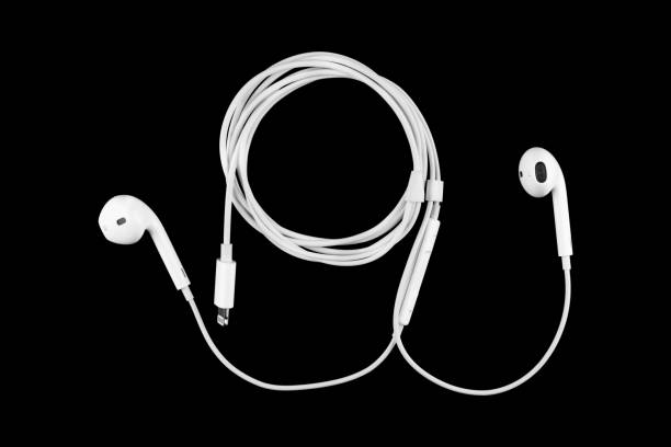 istock earphones on black background. 1131746490