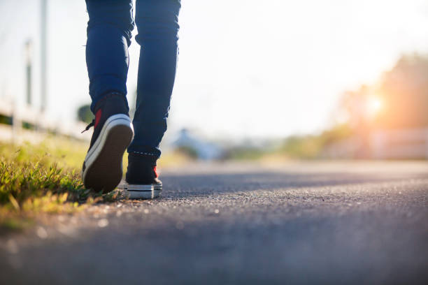 Close up of girl shoes walking Close up of girl shoes walking central reservation stock pictures, royalty-free photos & images