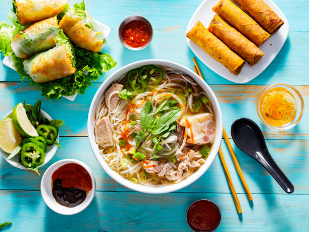 istock vietnamese pho bo soup with appetizers on table and drizzled with sriracha sauce 1131752152