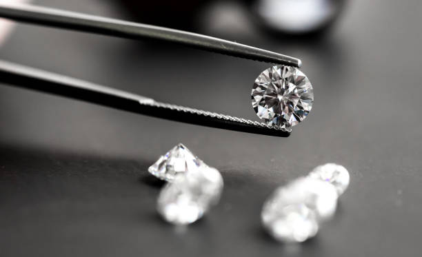 istock Diamond in Tweezers 1131752205