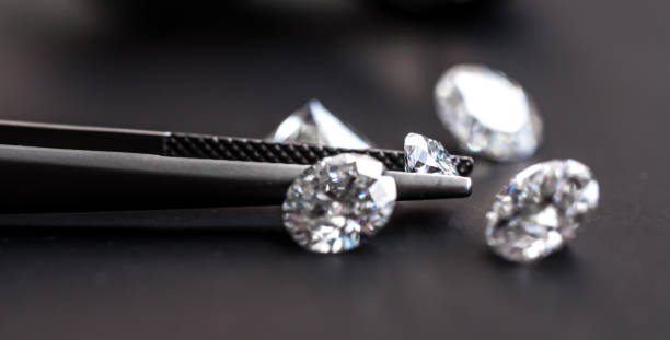 istock Diamond in Tweezers 1131752229