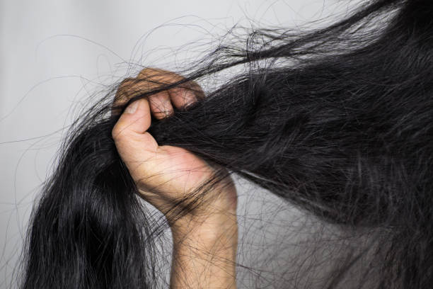 istock A middle-aged Chinese female combs her long black hair 1131752235