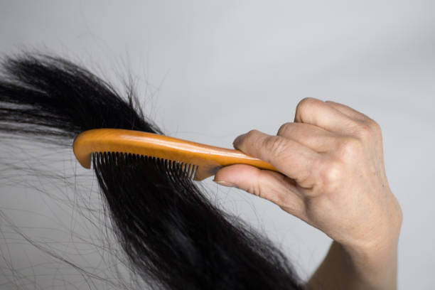 istock A middle-aged Chinese female combs her long black hair 1131752245