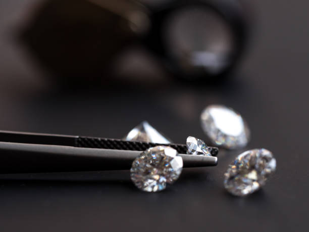 istock Diamond in Tweezers 1131752250