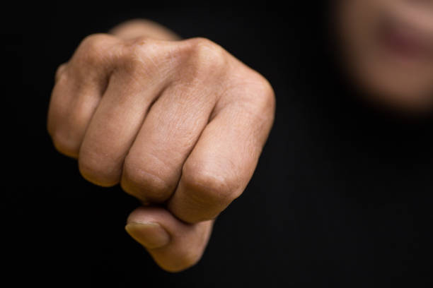istock A female protests with her fist and defends her rights 1131752970