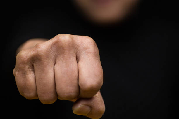istock A female protests with her fist and defends her rights 1131753001