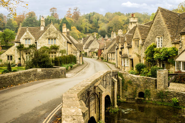 istock Bridge and Street - Castle Combe, England 1131753292