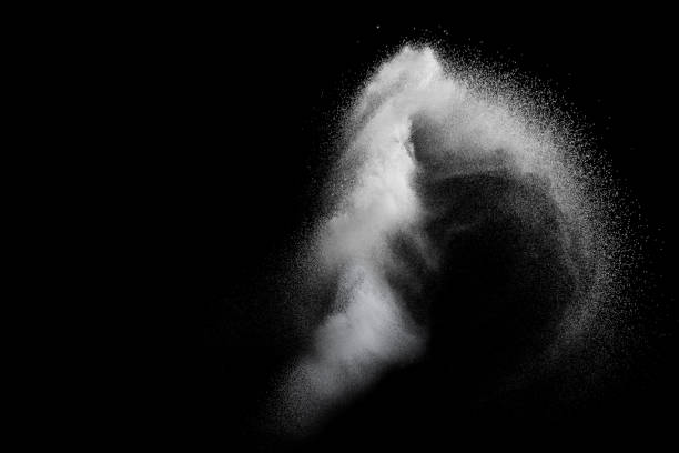 istock White powder explosion isolated on black background. White dust particles splash.Color Holi Festival. 1131754507