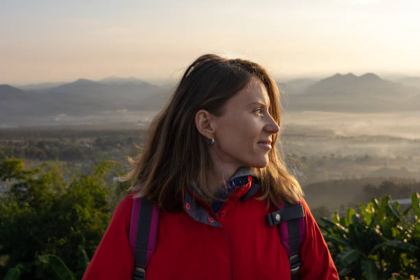 istock Young girl with backpack  hiking in the mountains 1131754604