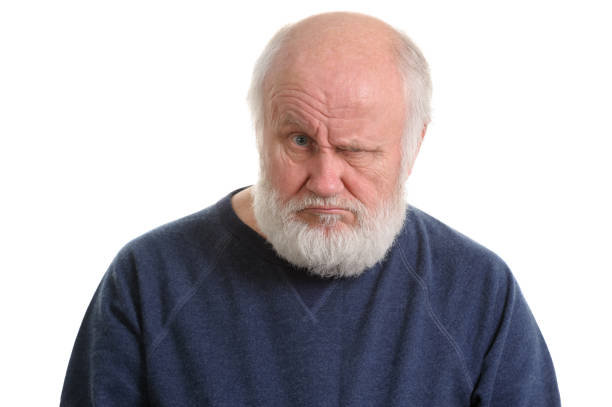 istock dissatisfied displeased old man isolated portrait 1131760893
