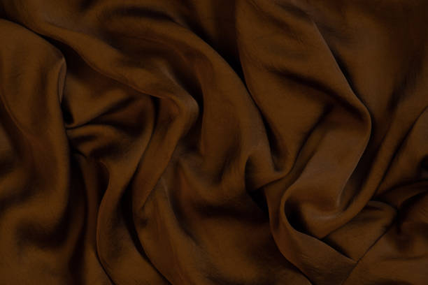 istock Texture of soft and shiny chocolate silk 1131761595