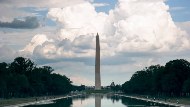 istock clouds building behind the washington monument in washington 1131765385