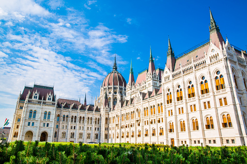 Gothic parliament exterior facade, magnificent blue sky in summer. Budapest, Hungary.
