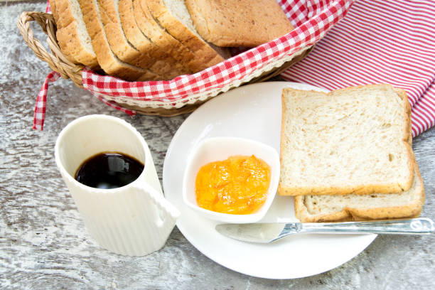 istock orange marmalade and bread for breakfast 1131768120