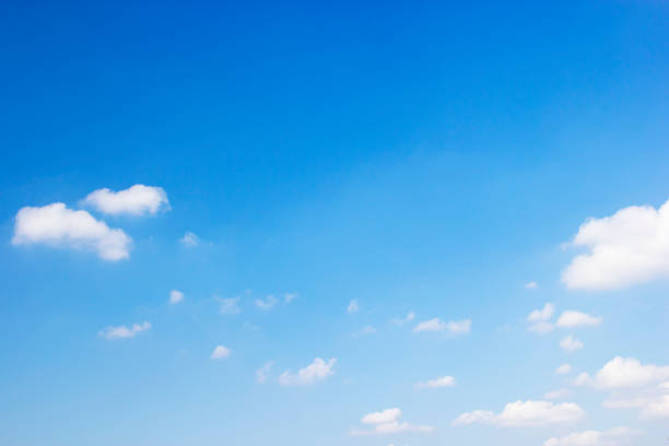 istock Blue sky background and white clouds soft focus, and copy space 1131769359