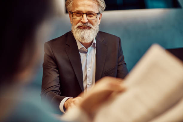 istock handsome caucasian senior CEO at a meeting 1131774888