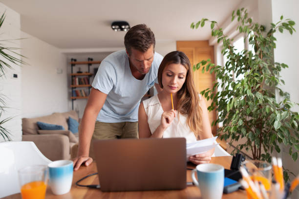 istock Young family discussing their finances 1131775712