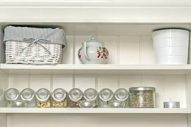 Photo of Kitchen shelf with jars.