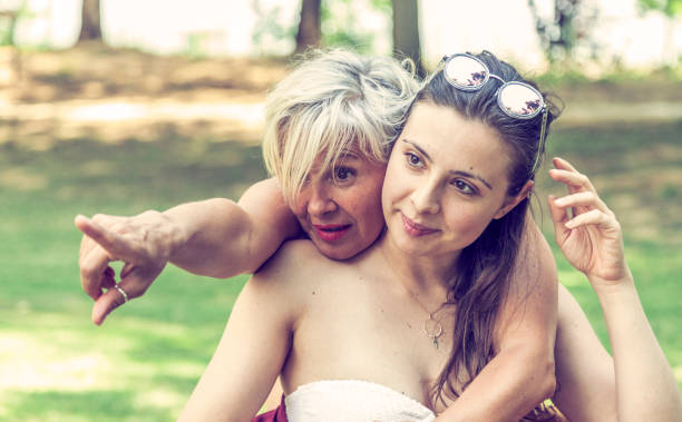 istock mother and daughter while posing hugged 1131779897
