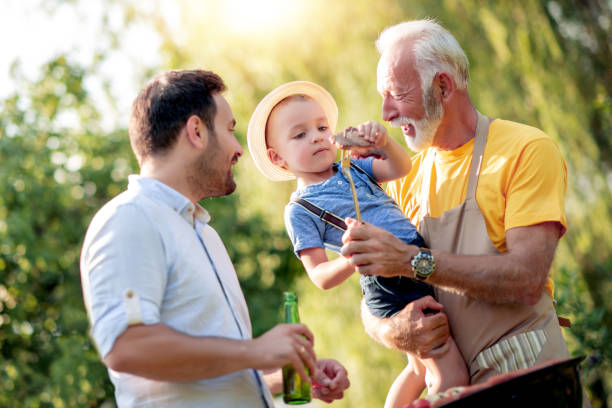 istock Happy family having barbecue party in backyard 1131781448