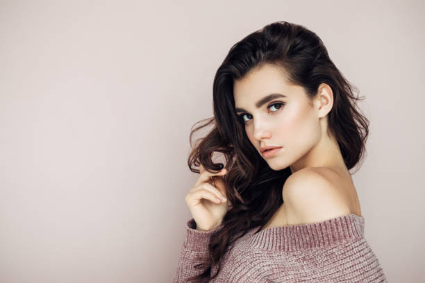 istock Beautiful woman with curly hair 1131783064