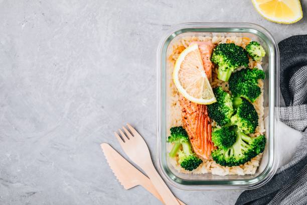 istock Meal prep lunch box containers with baked salmon fish, rice, green broccoli 1131783396