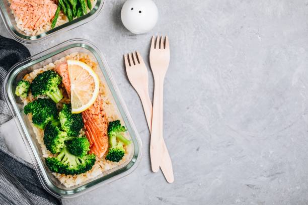 istock Meal prep lunch box containers with baked salmon fish, rice, green broccoli 1131784065