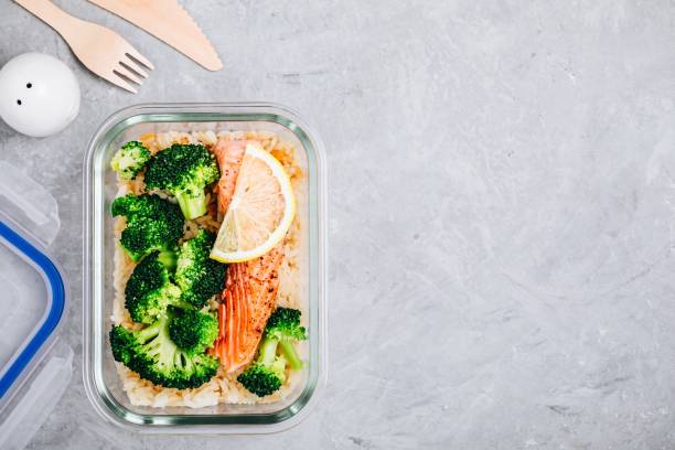istock Meal prep lunch box containers with baked salmon fish, rice, green broccoli 1131784185