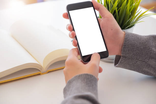 istock Close up Woman hand Using a Smart Phone with blank screen at home. 1131784476