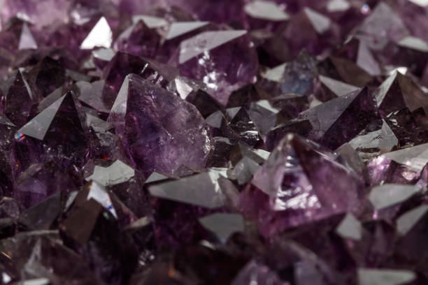 istock Amethyst Crystal Druse  macro mineral on white background 1131785645