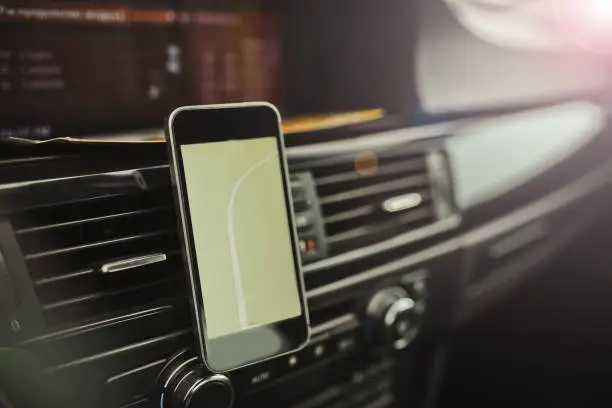 Photo of Navigator in the smartphone of a modern car.