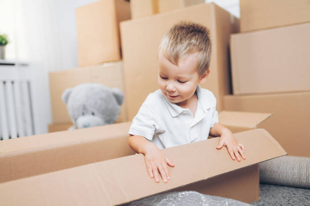 istock Cute toddler helping out packing boxes 1131787018