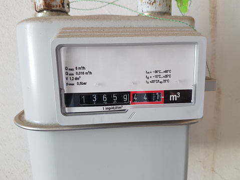 Household gas meter on the wall in kitchen, close-up