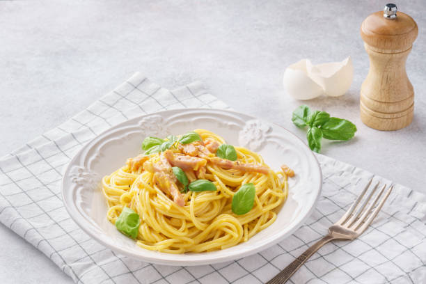 istock Italian pasta carbonara with ham, basil and eggs. 1131787175