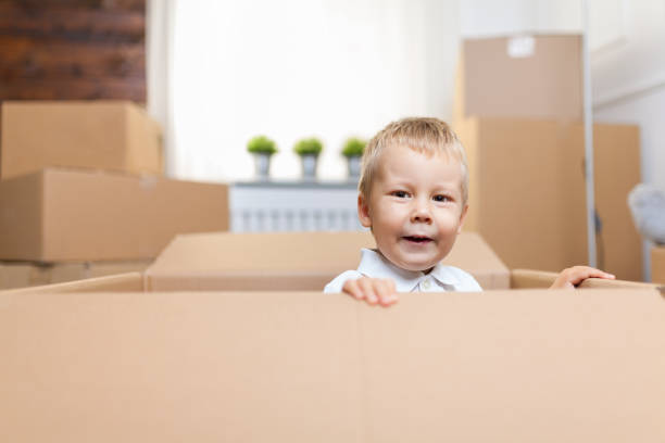 istock Cute toddler helping out packing boxes 1131787226