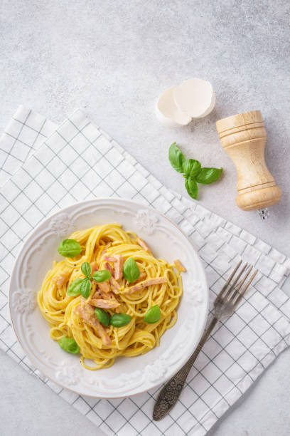 istock Italian pasta carbonara with ham, basil and eggs. 1131787246