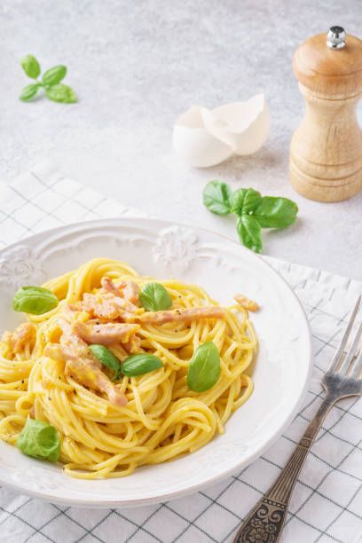 istock Italian pasta carbonara with ham, basil and eggs. 1131787378