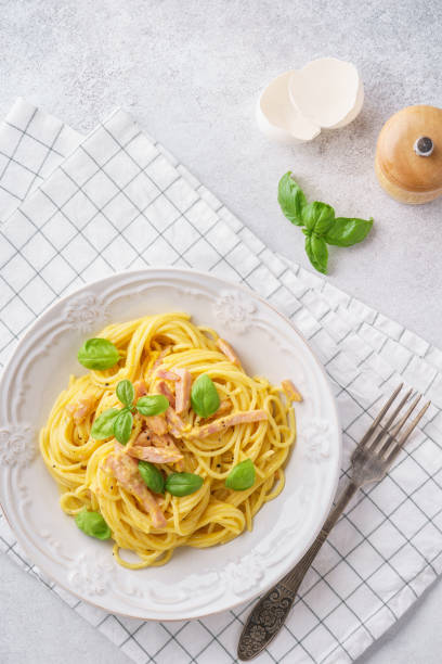 istock Italian pasta carbonara with ham, basil and eggs. 1131787479