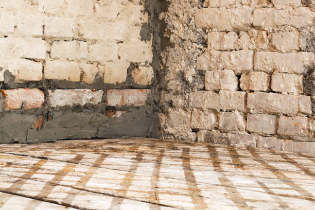 old stone wall corner and wooden floor - corner stone wall brick imagens e fotografias de stock