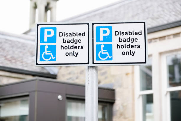 istock Disabled Badge Holders Only at Car Park Sign Post 1131791823