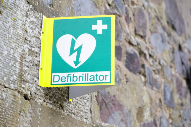 Defibrillator sign and symbol on wall Defibrillator sign and symbol on wall uk defibrillator photos stock pictures, royalty-free photos & images